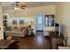Spacious living area with hardwood floors, comfy couch, and access to hallway at 7750 E Broadway Rd # 776, Mesa, AZ 85208