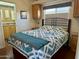 Main bedroom with a comfy bed, built-in cabinets, and en-suite bathroom access at 7750 E Broadway Rd # 776, Mesa, AZ 85208
