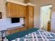 Main bedroom with ample storage, a cozy bed, and access to en-suite bathroom at 7750 E Broadway Rd # 776, Mesa, AZ 85208