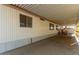 Mobile home exterior with carport and storage shed at 7807 E Main St # Cc-66, Mesa, AZ 85207