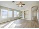 Living room featuring built-in shelving and hardwood-style flooring at 7832 W San Miguel Ave, Glendale, AZ 85303