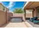 Private backyard hot tub with patio furniture at 1023 W Ingram St, Mesa, AZ 85201