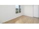 Bright bedroom with new flooring and large window at 1026 N 85Th Pl, Scottsdale, AZ 85257