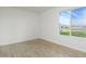 Spacious bedroom with large window and wood floors at 1026 N 85Th Pl, Scottsdale, AZ 85257