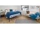 Bedroom with metal bed frame and blue bedding at 1026 N 85Th Pl, Scottsdale, AZ 85257