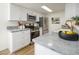 Modern kitchen with white cabinets and granite countertops at 1026 N 85Th Pl, Scottsdale, AZ 85257