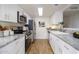 Modern kitchen with white cabinets and granite countertops at 1026 N 85Th Pl, Scottsdale, AZ 85257