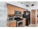 Stainless steel appliances and granite countertops in this kitchen at 11552 E Dover St, Mesa, AZ 85207