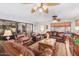 Relaxing living room featuring leather furniture and ample natural light at 13418 W Stardust Blvd, Sun City West, AZ 85375