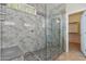 Spacious walk-in shower with glass enclosure and built-in seat at 2764 N Sterling St, Mesa, AZ 85207