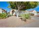 Charming one-story house with arched entryway and desert landscaping at 3114 E Wahalla Ln, Phoenix, AZ 85050