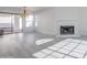 Living room with fireplace, hardwood floors, and sliding glass doors at 3310 E Longhorn Dr, Phoenix, AZ 85050