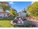 Landscaped backyard with fire pit and seating area at 34 W State Ave, Phoenix, AZ 85021