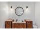 Bathroom with a vintage vanity and a large mirror at 34 W State Ave, Phoenix, AZ 85021