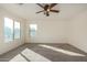 Spacious bedroom featuring a ceiling fan and ample natural light at 38191 W Merced St, Maricopa, AZ 85138