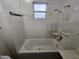 Clean bathroom with shower/tub combo, vanity, and tiled floors at 402 W Greenwich Rd, Kearny, AZ 85137