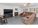 Gathering room showcasing a cozy fireplace and large sectional sofa at 5729 W Abraham Ln, Glendale, AZ 85308