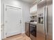 Laundry room with washer, dryer, and stainless steel refrigerator at 6240 S Dean Rd, Buckeye, AZ 85326