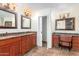 Elegant bathroom with double vanity, granite countertops, and a separate shower at 7634 W Julie Dr, Glendale, AZ 85308