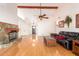 Spacious living room featuring hardwood floors and a large fireplace at 7634 W Julie Dr, Glendale, AZ 85308