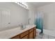 Main bathroom with a bathtub and wood vanity at 1015 E Mountain Sage Dr, Phoenix, AZ 85048