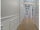 Bright hallway with tile flooring and white wainscoting at 10535 E Palladium Dr, Mesa, AZ 85212