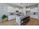 Modern kitchen with white cabinets, gray counters, and island at 10535 E Palladium Dr, Mesa, AZ 85212