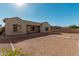 Spacious backyard with gravel landscaping and a covered patio at 11122 E Tripoli Ave, Mesa, AZ 85212