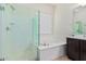 Bathroom with walk-in shower and garden tub at 11122 E Tripoli Ave, Mesa, AZ 85212