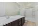 Bathroom with dark vanity, bathtub, and tiled floor at 11122 E Tripoli Ave, Mesa, AZ 85212