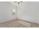 Bright bedroom with carpet flooring and plantation shutters at 11122 E Tripoli Ave, Mesa, AZ 85212