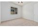 Bright bedroom with carpet flooring and ceiling fan at 11122 E Tripoli Ave, Mesa, AZ 85212