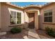 Front entry with brown door and stone pathway at 11122 E Tripoli Ave, Mesa, AZ 85212