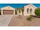 Single-story home with desert landscaping and two-car garage at 11122 E Tripoli Ave, Mesa, AZ 85212