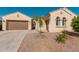 Single-story home with desert landscaping and two-car garage at 11122 E Tripoli Ave, Mesa, AZ 85212