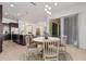 Eat-in kitchen with island and dark brown cabinetry at 11122 E Tripoli Ave, Mesa, AZ 85212