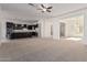 Open living room with neutral carpet and view to kitchen at 11122 E Tripoli Ave, Mesa, AZ 85212