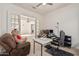 Home office with view into adjacent living space at 11122 E Tripoli Ave, Mesa, AZ 85212
