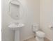 Clean powder room with pedestal sink and tile floor at 11122 E Tripoli Ave, Mesa, AZ 85212