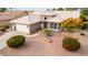 Single-story home with tile roof, landscaping, and a two-car garage at 15192 W Las Brizas Ln, Sun City West, AZ 85375