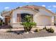 One-story home with desert landscaping and two-car garage at 18315 N Canal Dr, Surprise, AZ 85374