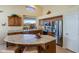 Kitchen boasts an island, stainless steel appliances, and wood cabinets at 18315 N Canal Dr, Surprise, AZ 85374