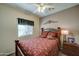 Charming bedroom with floral bedding and ceiling fan at 2101 S Meridian Rd # 131, Apache Junction, AZ 85120