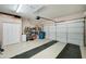 Attached garage with storage shelving and extra space at 2101 S Meridian Rd # 131, Apache Junction, AZ 85120