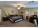 Bright bedroom featuring a king-size bed and ensuite bathroom at 2101 S Meridian Rd # 248, Apache Junction, AZ 85120