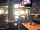 Sports bar atmosphere with TVs, tables, and barstools for casual dining at 25813 S Brentwood Dr, Sun Lakes, AZ 85248