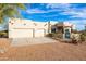 Single-story home with a two-car garage and desert landscaping at 29523 N 146Th St, Scottsdale, AZ 85262