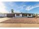 Updated mid-century modern home with a charming front yard and a newly paved driveway at 332 N 56Th St, Mesa, AZ 85205