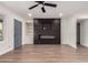 Bright living room with new flooring, fireplace, and built-in shelving at 332 N 56Th St, Mesa, AZ 85205