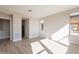 Light-filled bedroom with hardwood floors and access to bathroom at 375 E Bracciano Ave, Queen Creek, AZ 85140